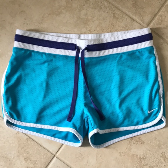 Nike light blue mesh track shorts in Medium.
